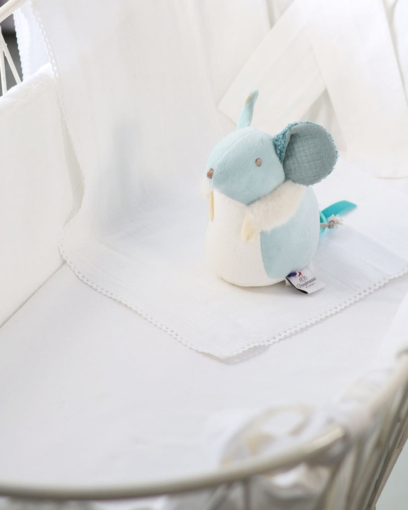 Plush toy mouse on a white surface