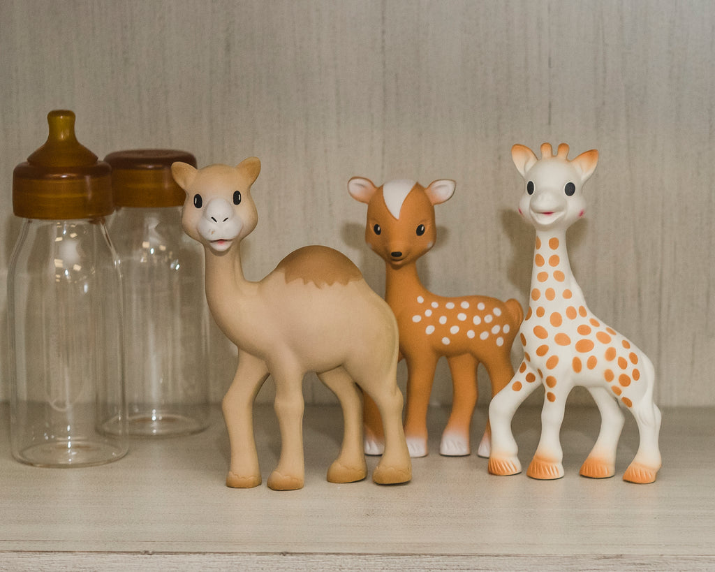 three animal themed teethers standing together