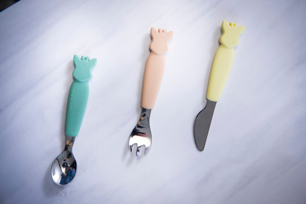 Three utensils from sophie cutlery set resting on kitchen counter