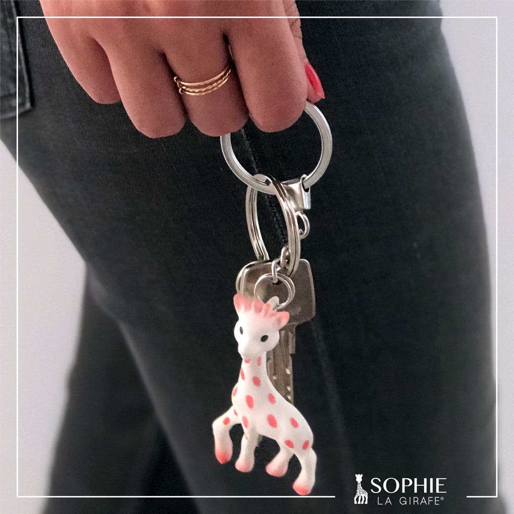 Pink sophie the giraffe keychain attached to keys