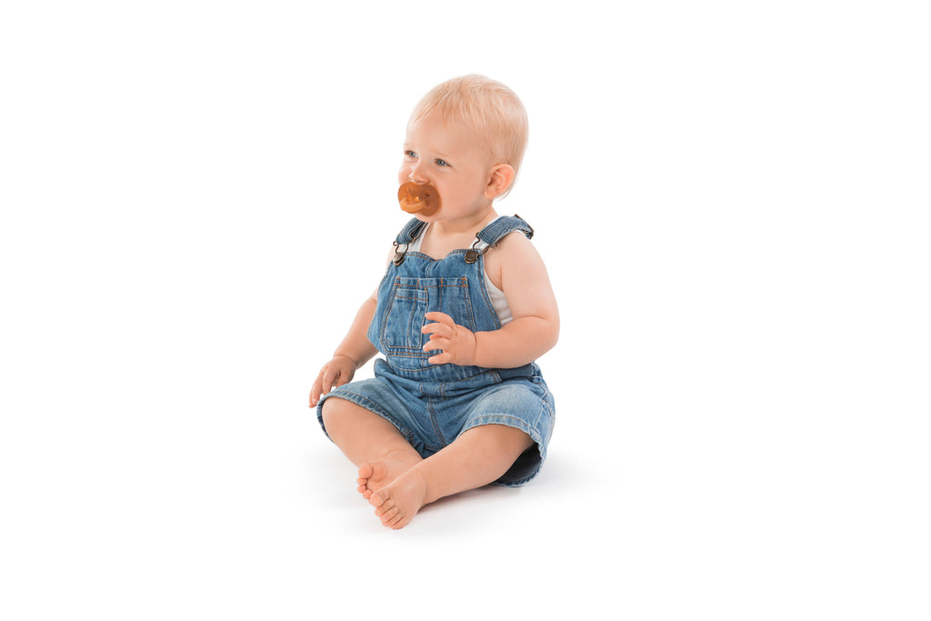 Baby teething on so'pure natural rubber pacifier