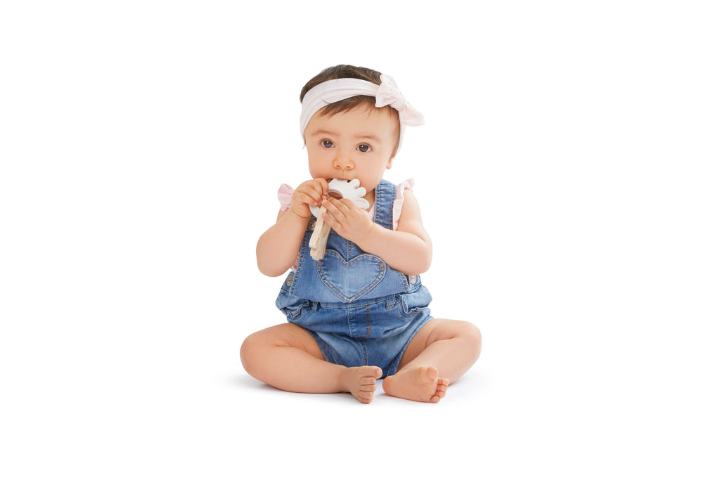 Baby playing and teething with sophie so'pure silhouette rings