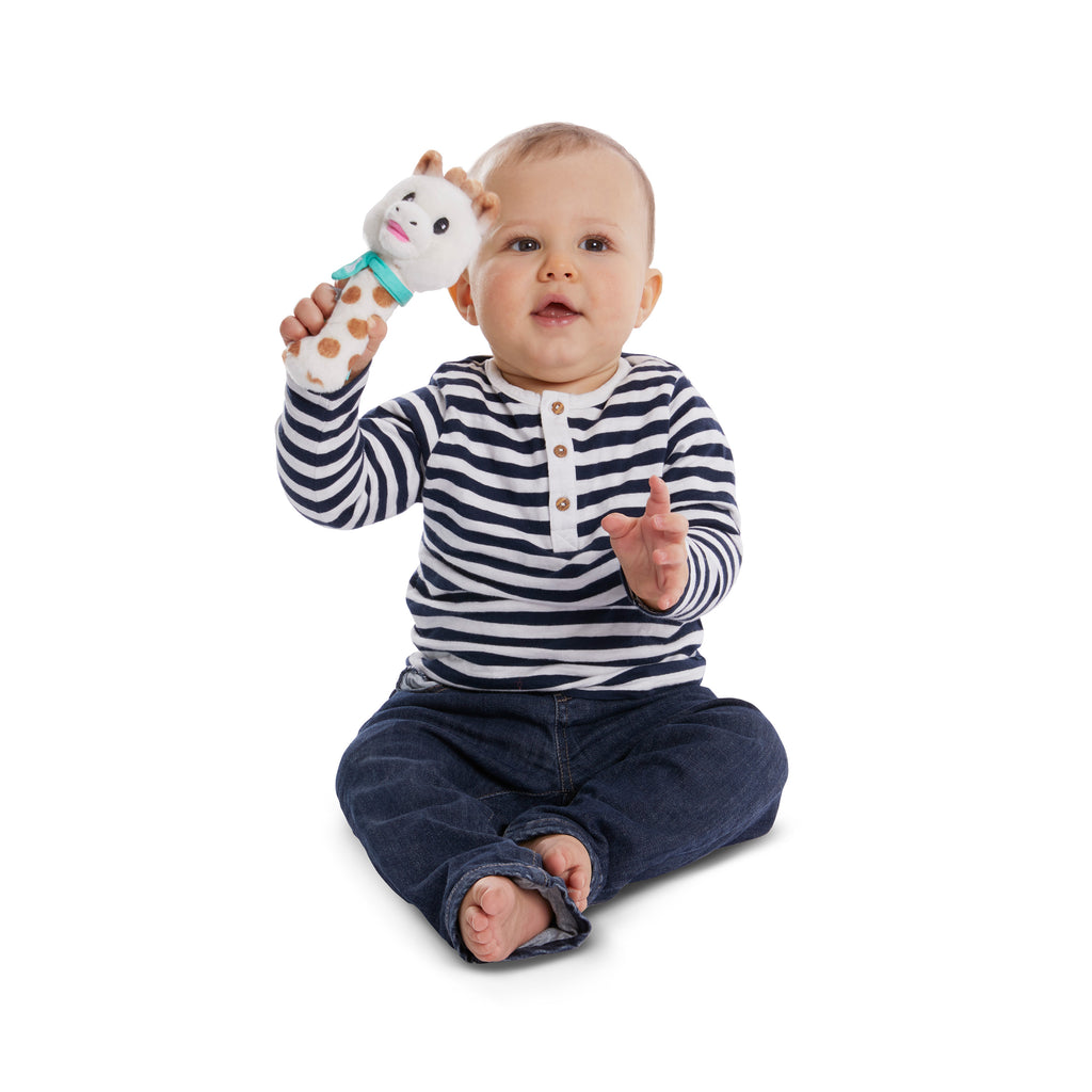 Baby playing with sophie sweetie pouet rattle